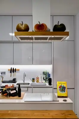 a kitchen with two apples sitting on the shelves at Cristalia,Roof terrace in city center, Garage, Netflix 75inch TV in Funchal
