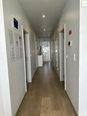 an empty hallway with white walls and wood floors at Casa Bela Vista in Venda do Atalhinho