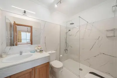 a bathroom with a sink toilet and a shower at OurMadeira - Moradia da Falésia in Câmara de Lobos