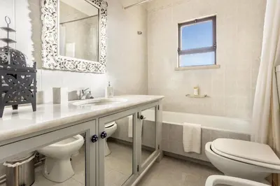 a bathroom with a sink and a toilet and a tub at Casa da Ermida in Budens