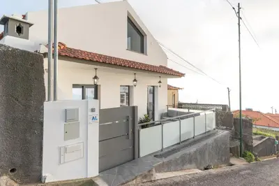 a house with a gate and a wall at Casa Zé, in Arco da Calheta