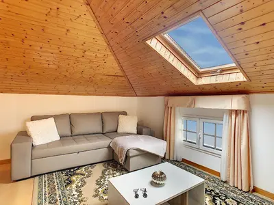 a living room with a couch and a skylight at Casa Leão de Ouro by LovelyStay in São Jorge