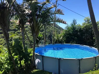 a gazebo with lights and a couch under it at maderedocevida in Boaventura