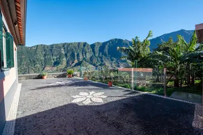a driveway with a view of the mountains at Cristina Grand in São Vicente