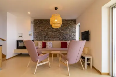 a living room with a couch and chairs at Villa Flora - Nature & Tranquility - Heated pool optional in Jardim do Mar
