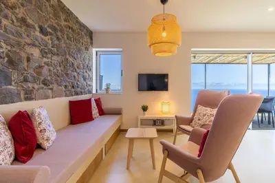 a living room with a couch and chairs at Villa Flora - Nature & Tranquility - Heated pool optional in Jardim do Mar