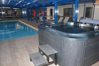 a hot tub next to a swimming pool at Relax View in Funchal