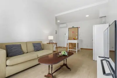a living room with a couch and a table at Ribeira das Casas by Homie in Funchal