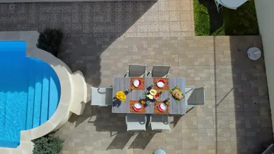 an overhead view of a table next to a pool at Casa Eleanor by LovelyStay in Calheta