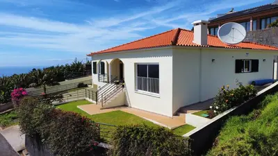 a small house with a view of the ocean at Casa Eleanor by LovelyStay in Calheta