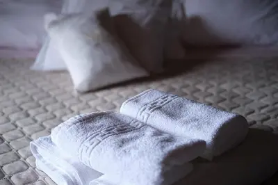 a pair of white socks sitting on a bed at Ga281 in Funchal