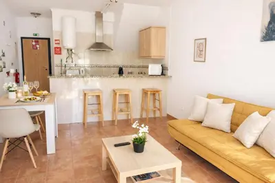 a living room with a couch and a table at Casadaluz 18 in Luz
