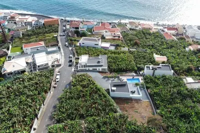 an aerial view of houses and the ocean at O pomar - A quiet SUNNY place with amazing SEA views in Paul do Mar