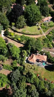 an aerial view of a house with a yard at Quinta Das Faias in Camacha