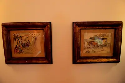 two framed pictures of animals on a wall at Quinta Das Faias in Camacha