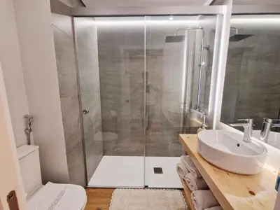 a bathroom with a shower and a sink at Princesa Madeira in Funchal