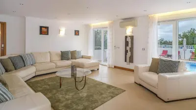 a living room with a couch and a table at Casa Monte Cristo Too in Lagos