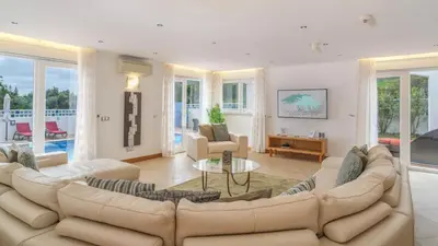 a living room with a couch and a table at Casa Monte Cristo Too in Lagos