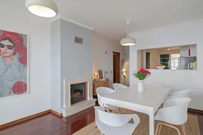 a white dining room with a white table and chairs at Casa Skyline by An Island Apart in Caniço