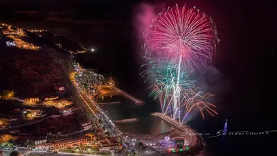 a firework display at night with a city at Martinho Apartment View in Arco da Calheta