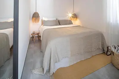 a bedroom with a large bed in a room at Casas da Praia by Sevencollection in Salema