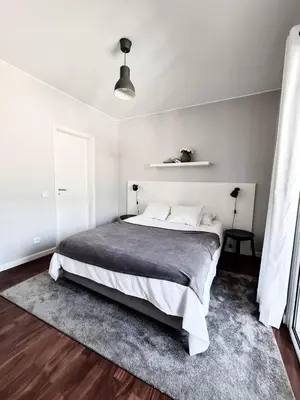 a bedroom with a large bed in a white room at Santa Luzia's Pearl V - Two Bed Apartment in Funchal