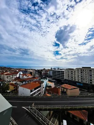 a city with buildings and a cloudy sky at Santa Luzia's Pearl V - Two Bed Apartment in Funchal