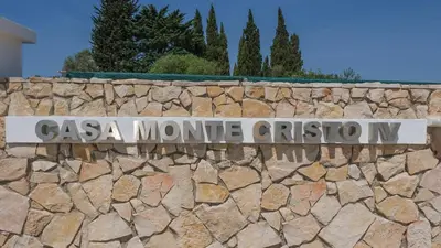 a stone wall with a sign that reads casa monte cristo n at Casa Monte Cristo IV in Lagos