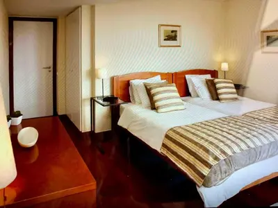 a bedroom with a large bed with pillows at Charming Lido Flat I in Funchal