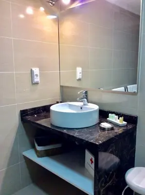 a bathroom with a sink and a mirror at Charming Lido Flat I in Funchal