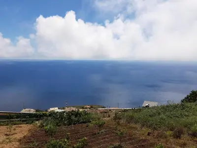 a view of a large body of water at Refúgio de Pedra in Fajã da Ovelha