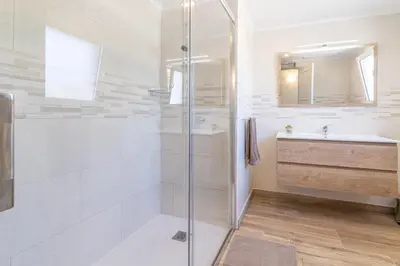 a bathroom with a shower and a sink at Casa Dean by Algarve Golden Properties in Lagos
