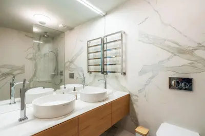 a bathroom with two sinks and a mirror at Barreirinha Front-Line Sea View II by Holiday Rental Madeira in Funchal