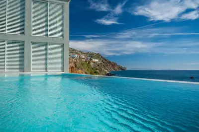 a swimming pool with a view of the ocean at Barreirinha Suite Top Floor by Holiday Rental Madeira in Funchal