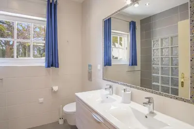a bathroom with a sink and a mirror at Casa Monte Cristo Tres in Lagos