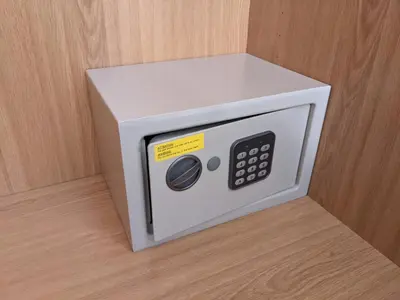 a microwave oven sitting on top of a wooden wall at Casa Monte Cristo Apartments - Orange in Lagos
