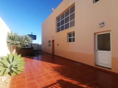 a building with a door and a tile floor at O DRAGOEIRO da Madalena! in Porto Santo