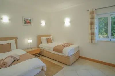 a bedroom with two beds and a window at Casa Monte Cristo Apartments - Lemon in Lagos