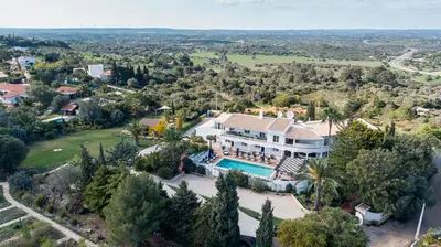 an aerial view of a house with a swimming pool at Casa Monte Cristo Apartments - Lemon in Lagos