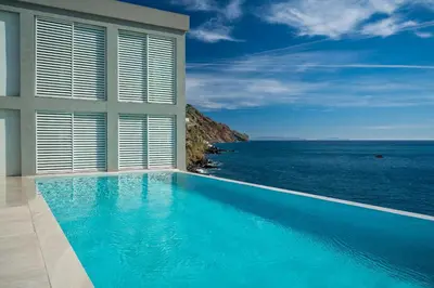 a swimming pool with a view of the ocean at Barreirinha Suite by Holiday Rental Madeira in Funchal