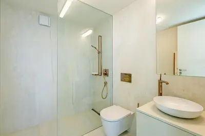 a bathroom with a sink and a toilet and a shower at Barreirinha Suite by Holiday Rental Madeira in Funchal