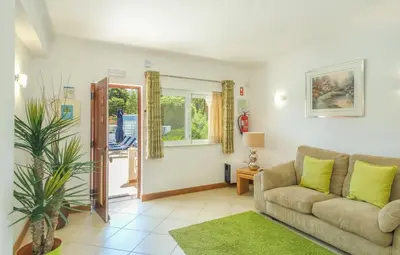 a living room with a couch and a window at Casa Monte Cristo Apartments - Lime in Lagos