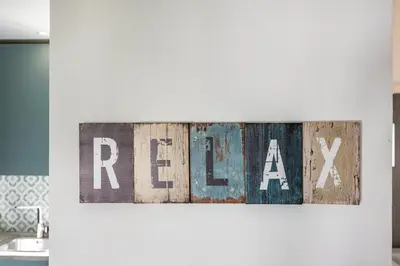 a sign with the word rex on a wall at Salema Beach House in Salema