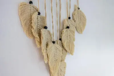 a bunch of dried feathers hanging on a wall at Salema Beach House in Salema