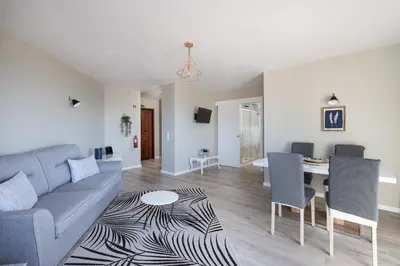a living room with a couch and a table at ALEGRIA II in Funchal