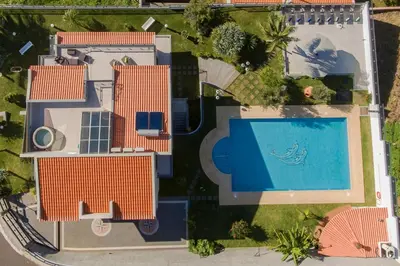 an overhead view of a swimming pool in a house at Exquisite Madeira Villa Villa Funchal Belair 4 Bedroom Panoramic Sea View in Funchal
