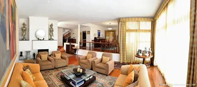 a living room with a couch and chairs and a table at Exquisite Madeira Villa Villa Funchal Luz 5 Bedroom Heated Pool in Funchal