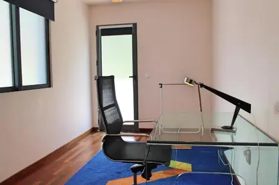 a glass table with a lamp and two chairs in a room at Extravagant Calheta Villa The Designhouse 4 Bedrooms Stunning Sea Views in Arco da Calheta