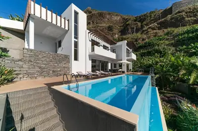 an image of a villa with a swimming pool at Extravagant Calheta Villa The Designhouse 4 Bedrooms Stunning Sea Views in Arco da Calheta