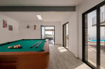 a billiard room with a pool table at Luxury Calheta Villa Casa Da Rosalina 5 Bedrooms Stunning Sea Views in Calheta